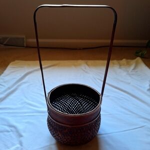 Brown Cylindrical Basket with Woven Texture and Handle